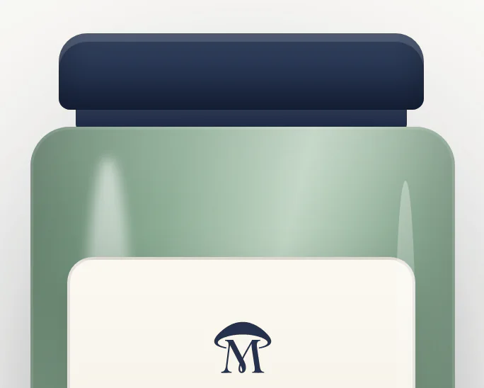 The same jar in sage-tinted glass, with the navy lid and the cream label carrying the mark.